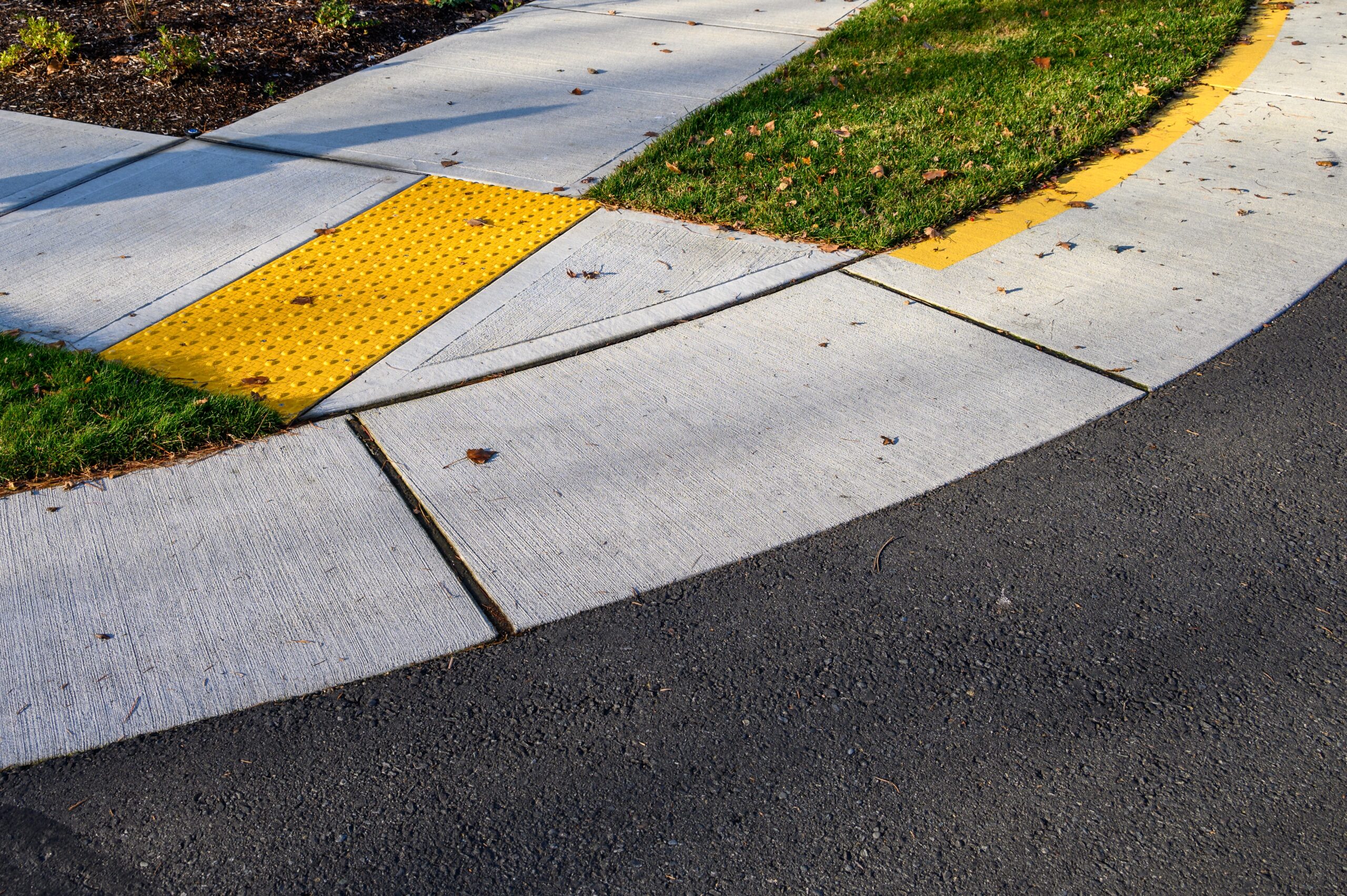 Closeup,Of,Disabled,Sidewalk,Entry,On,A,Cold,Sunny,Day,