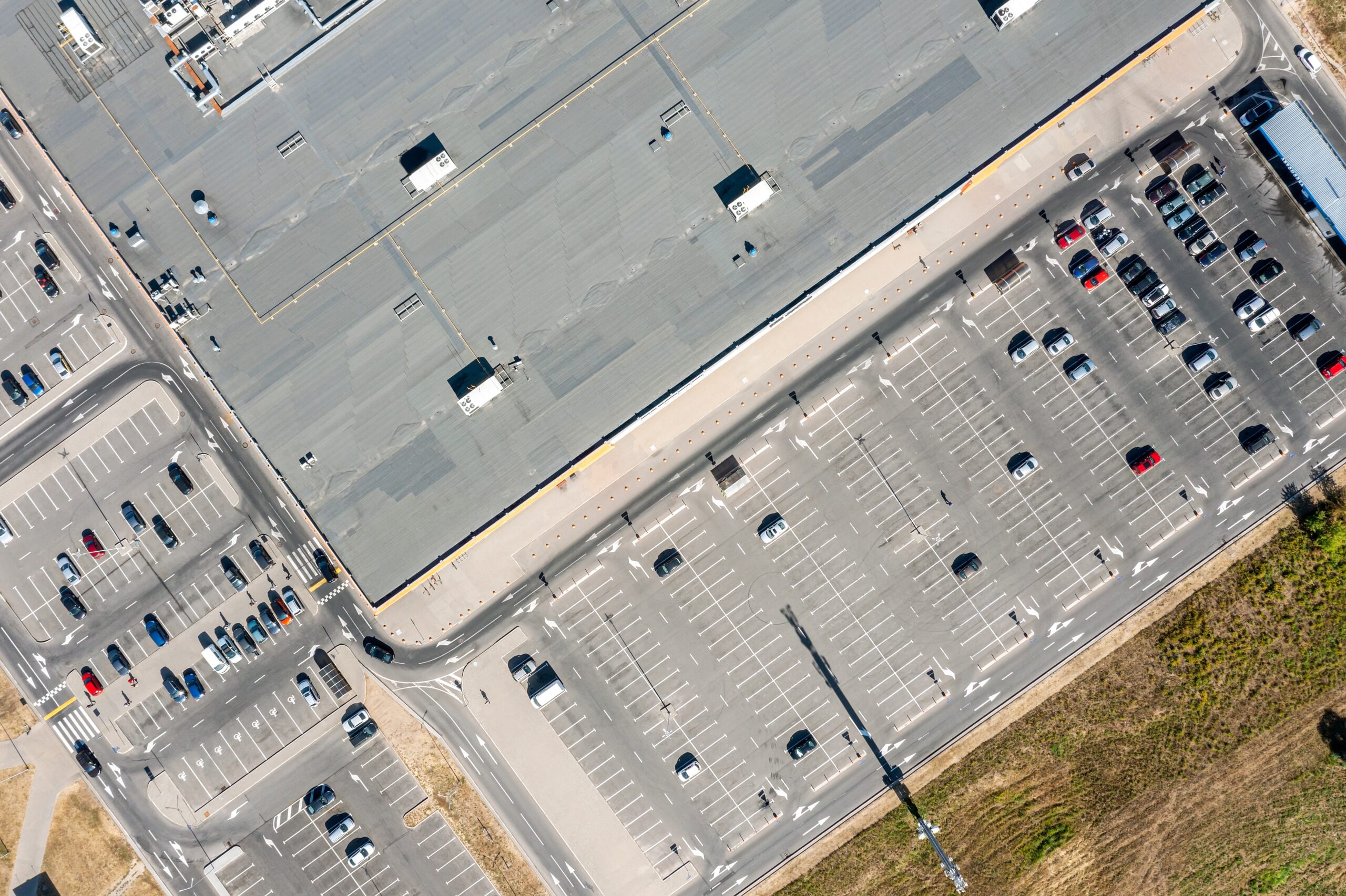 Supermarket,Roof,And,Many,Cars,In,Parking.,Aerial,Drone,Photo