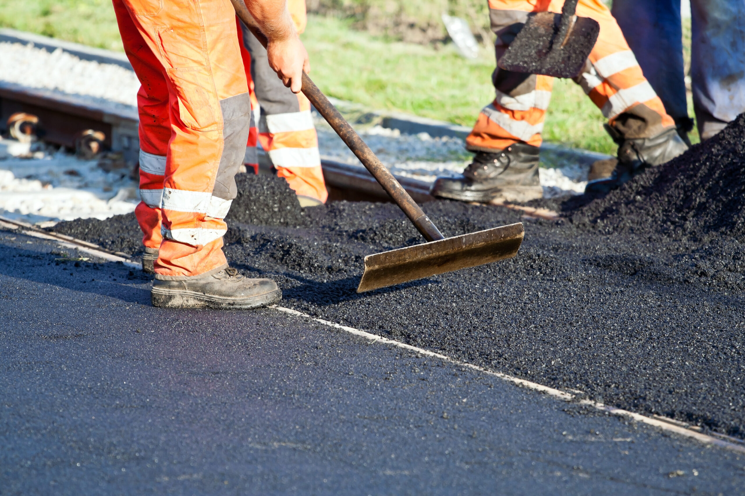 Workers,On,A,Road,Construction,,Industry,And,Teamwork